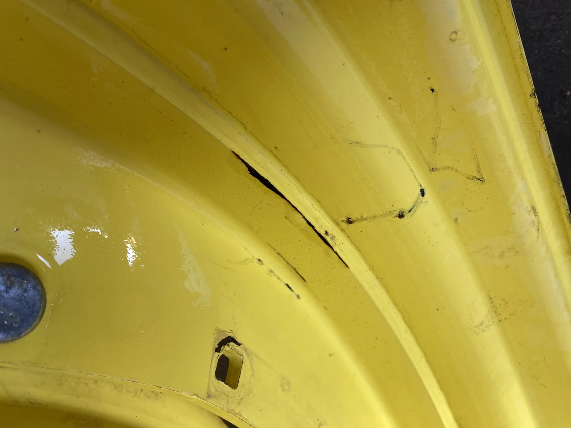Used 10 X 42 John Deere Yellow Waffle Wheel (3 Bolt) (Faded Paint with Scratches) - Fair Condition image 8