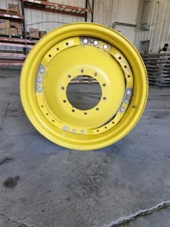 Used 15 x 34 10-13.19-11.07 Yellow Waffle Wheel w/ Disc