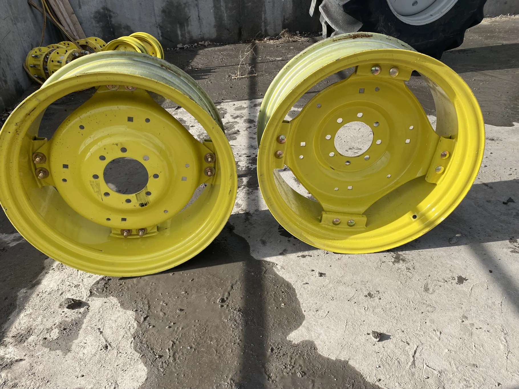Used 12 X 28 John Deere GKN Waffle Wheel (8-8-6) center. Scratches, scuffs, rust.