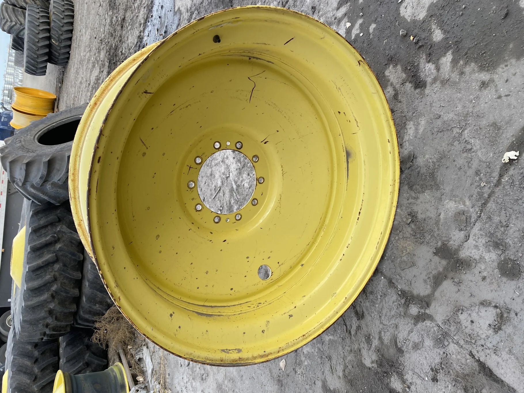 Used 16 X 46 JD yellow 10 dual wheel ( 10-13-11) Faded paint, rust, gashes/scratches, bent lip
